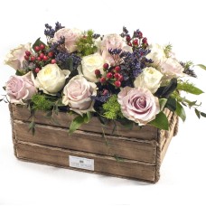 Roses arrangement in wooden box